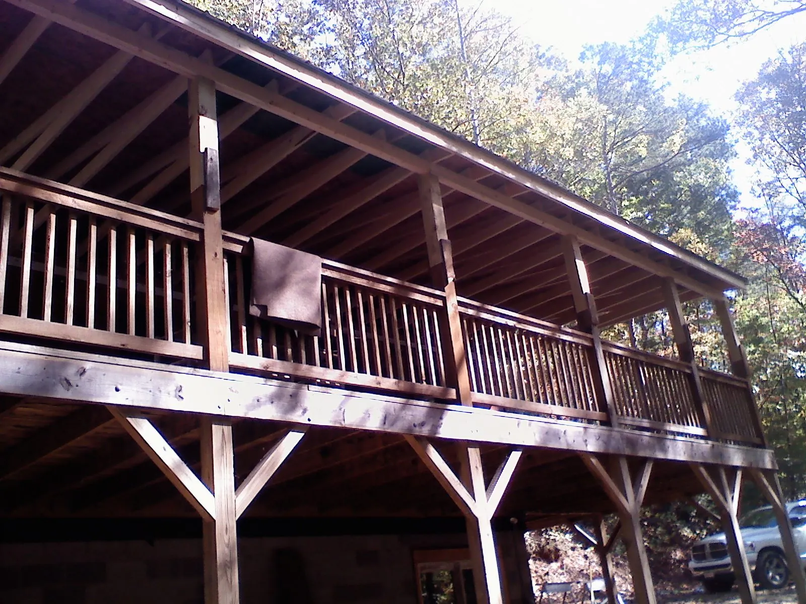 Timber framing under a new elevated porch and deck — Roof Leak Repair in Maxbass by Roofing Brothers